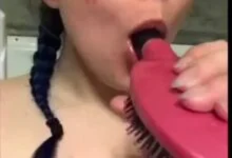 Using A Brush On Herself